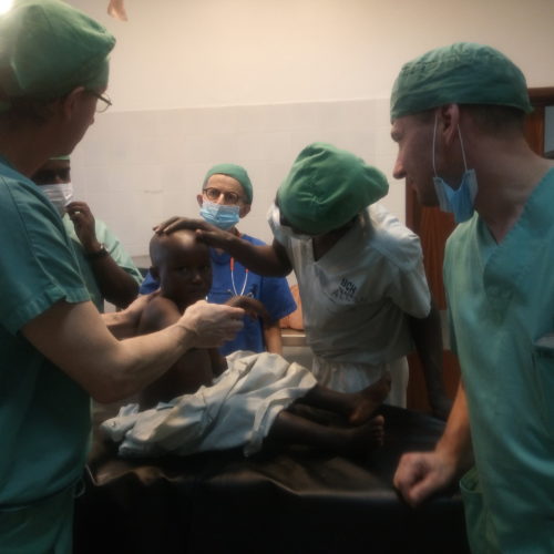 A child listens to explanations about his operation